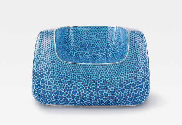 The bluish and sculptural armchair by Marc Newson. Photo: Artsy